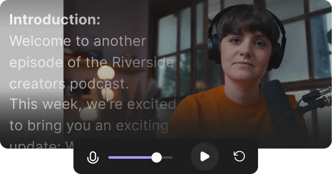 Woman wearing headphones speaking into a microphone in a room with large windows.